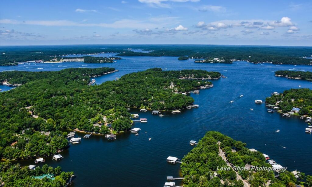 Aerial view of lakefront homes and marina docks in Camdenton Missouri near the Lake of the Ozarks